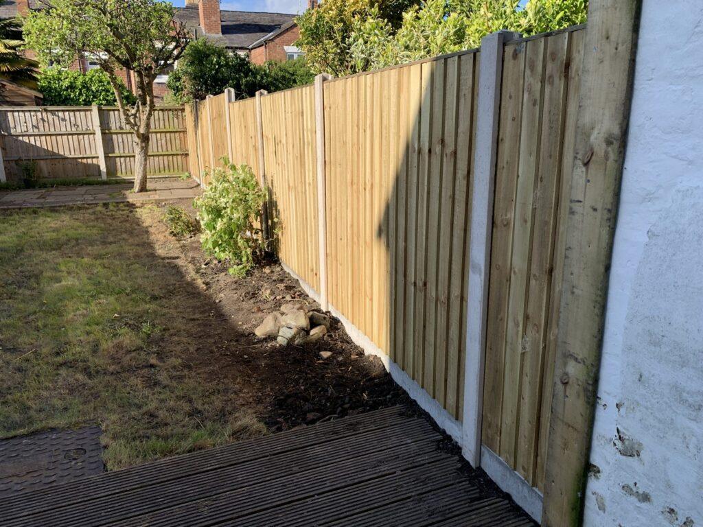 feather edge panel fence with concrete posts